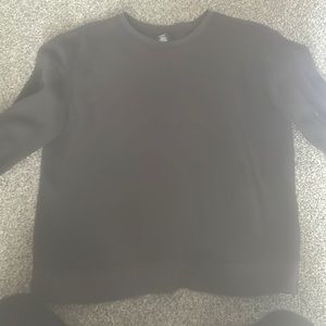 This is a plain black crew neck in a size small